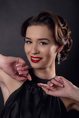 Beautiful gorgeous woman with elegant wavy hairstyle, bright make up.