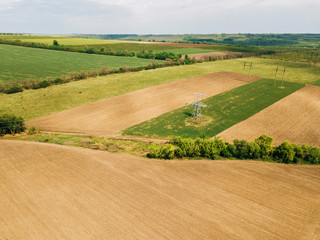 Fototapeta na wymiar Aerial drone photo of cereal farm land during spring time.