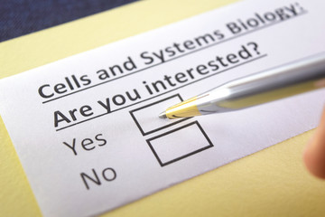 Obraz premium One person is answering question about cells and systems biology.