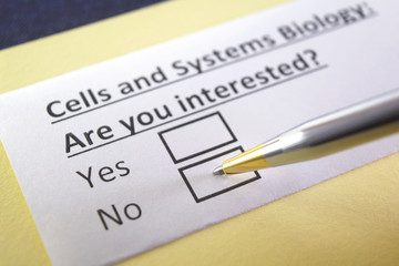 Obraz premium One person is answering question about cells and systems biology.