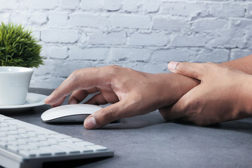 young man suffering pain in hands, Close up 