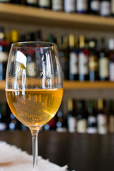 Full white wine glass on the table