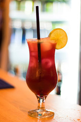 Colorful alcoholic drink, cocktail in the bar with juice and lemon