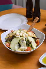 avocado, tomato, lettuce, green apple, mixed salad ready for presentation