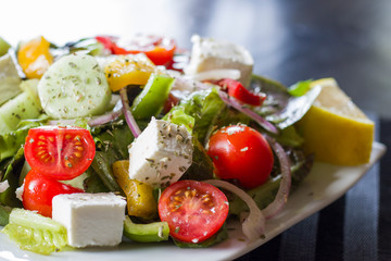 Vegetable Greece salad on the white plate