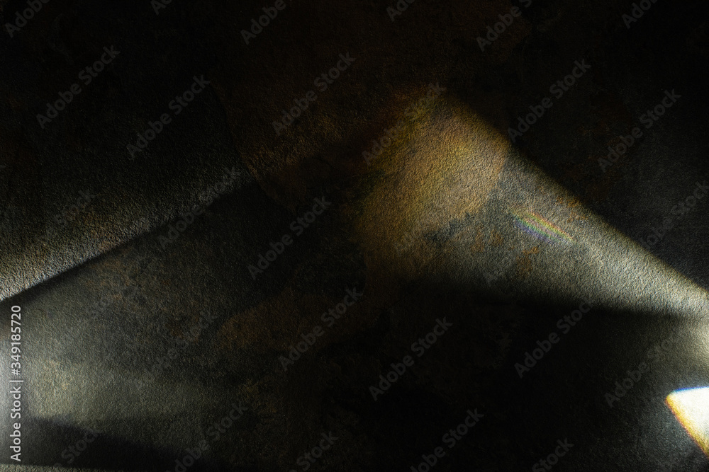 Sticker light prism with beams on dark stone texture background