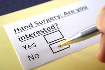 One person is answering question about hand surgery.