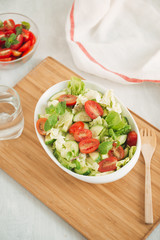 Vegetable mix salad in a bowl on kitchen table