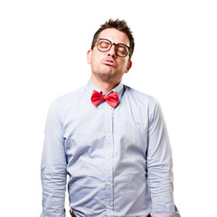 Man wearing a red bow tie. Looking tired.