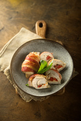 Chicken rolls with bacon, bell pepper and cheese