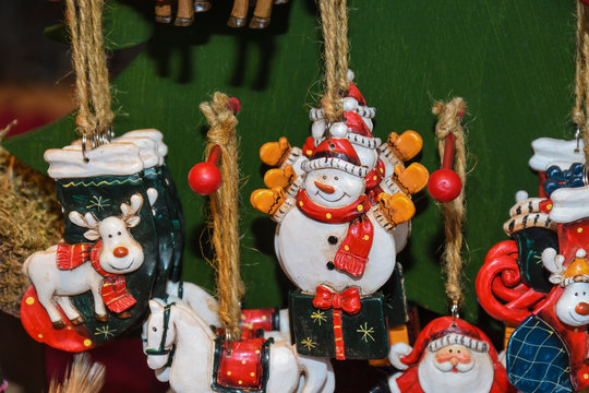 Christmas wood toy decorations and ornaments on the market in Vienna. For sale on Christmas fair