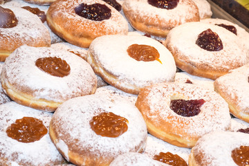 Display of traditional doughnuts on sale at Christmas market stall in Austria