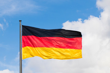 Germany flag closeup in wind. red, black and yellow colors.