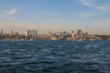 Fototapeta premium View of the Taksim district of Istanbul from the Bosphorus at sunset. Turkey