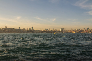 Fototapeta premium View of the Taksim district of Istanbul from the Bosphorus at sunset. Turkey