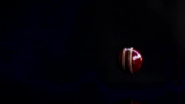 Cricket ball rotate on black background