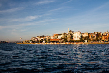 Fototapeta na wymiar View of the Uskudar district of Istanbul from the Bosphorus at sunset. Turkey