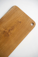 Solid wooden cutting board, handmade  isolated on white background.