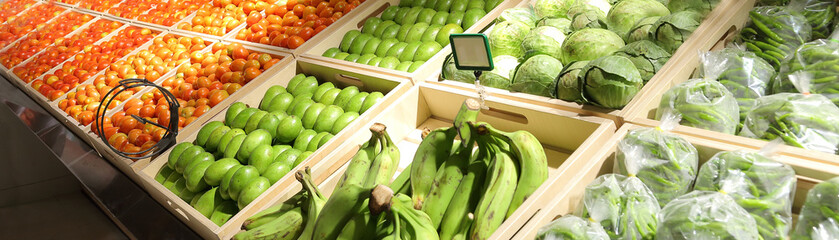 fruit background in the supermarket,Fruits and vegetables ,Fresh organic Vegetables and fruits on shelf in supermarket