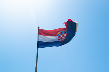 Croatian flag on a blue sky in summer
