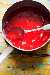 Strawberry jelly liquid in pot