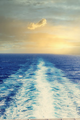 Wake from a Cruise ship into distance on blue sea