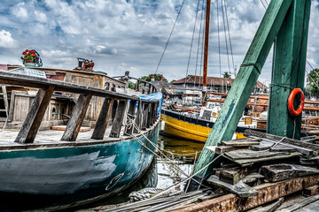 Fototapeta na wymiar Boats standing at the port with clouds covering the sky