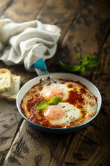 Fried eggs with tomato sauce or shakshuka