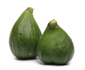 Young green figs isolated on white background