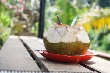 Fresh, sweet and delicious coconut on a wooden table