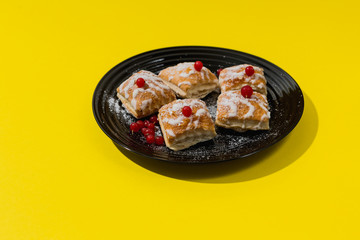 gourmet French pastries decorated with red currant berries