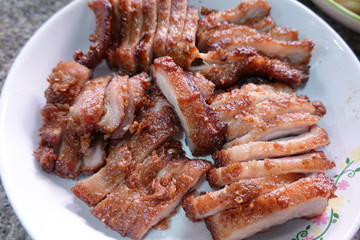 traditional Thai culture air fryer fried pork cuisine style or moo tod krob favorite famous street fast foods menu at thailand homemade
with hot spicy sauces on table wood dish sticky rice vegetable