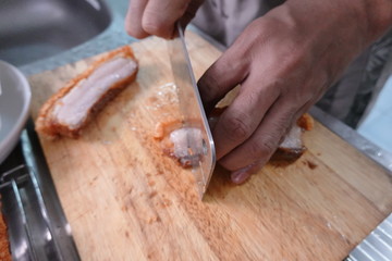 traditional Thai culture air fryer fried pork cuisine style or moo tod krob favorite famous street fast foods menu at thailand homemade
with hot spicy sauces on table wood dish sticky rice vegetable