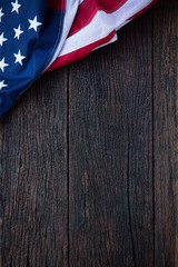 America flag waving pattern on wooden background in table top view, red blue white strip concept for USA 4th july independence day, symbol of patriot and democracy. pride in memorial day of liberty