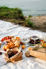 Romantic picnic with wine and snacks outdoors