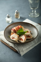 Chicken rolls with bacon, bell pepper and cheese