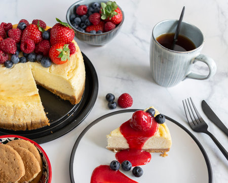 Raspberry and blueberry cheesecake tea party flat lay 