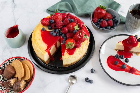 Raspberry and blueberry cheesecake tea party flat lay 