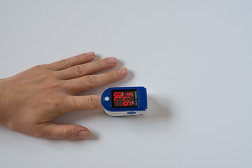 Hand with a pulse oximeter