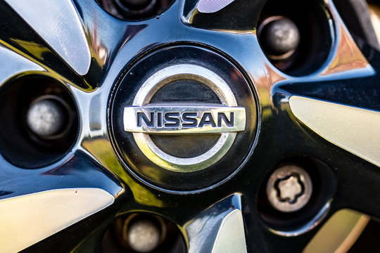 SURREY, UK- MAY, 2020: Nissan Logo Close Up On Alloy Wheel - Japanese Car Manufacturer