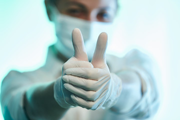 Woman wearing examination latex gloves