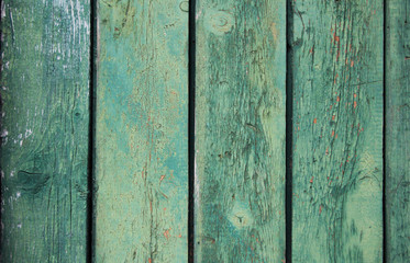 beautiful wooden background with cracked paint in bruise color