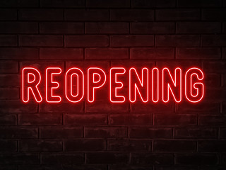 Reopening - red neon light word on brick wall background	
