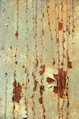 background rusty iron wall with light green paint texture with cracks