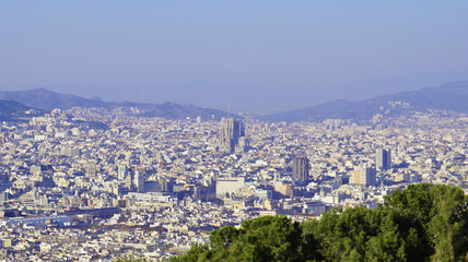 View of Barcelona from Montjuic. Church Sagrada Familia from above, in the city center.