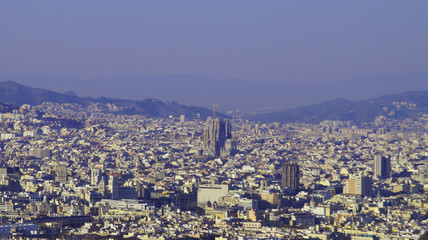 Fototapeta na wymiar View of Barcelona from Montjuic. Church Sagrada Familia from above, in the city center.