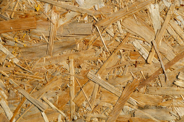 Natural yellow background from particle board close up