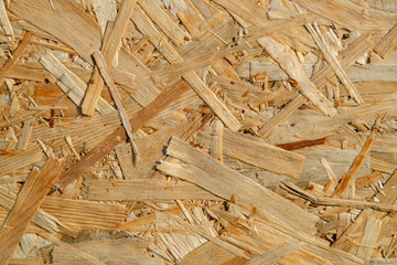 Natural yellow background from particle board close up