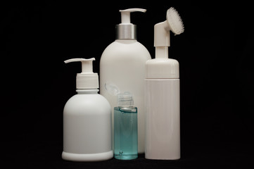 white plastic cosmetic bottle on black background