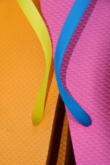 Close up of colorful flip flops